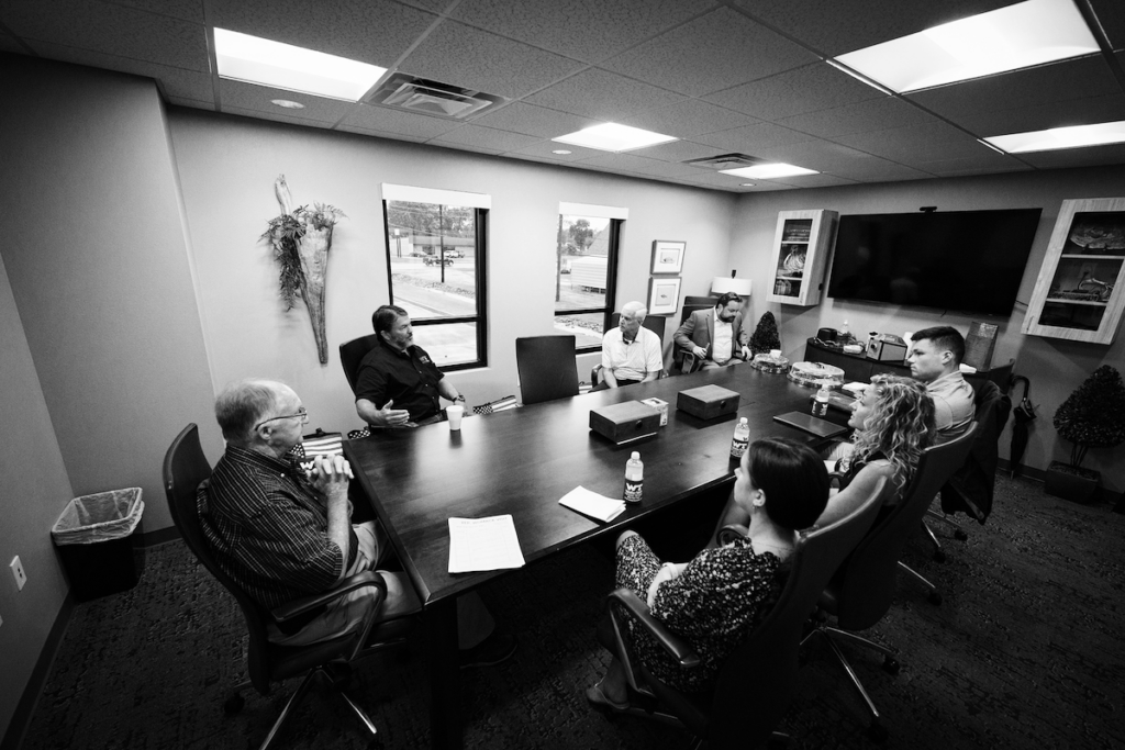 A black and white image of a Water Tech board meeting
