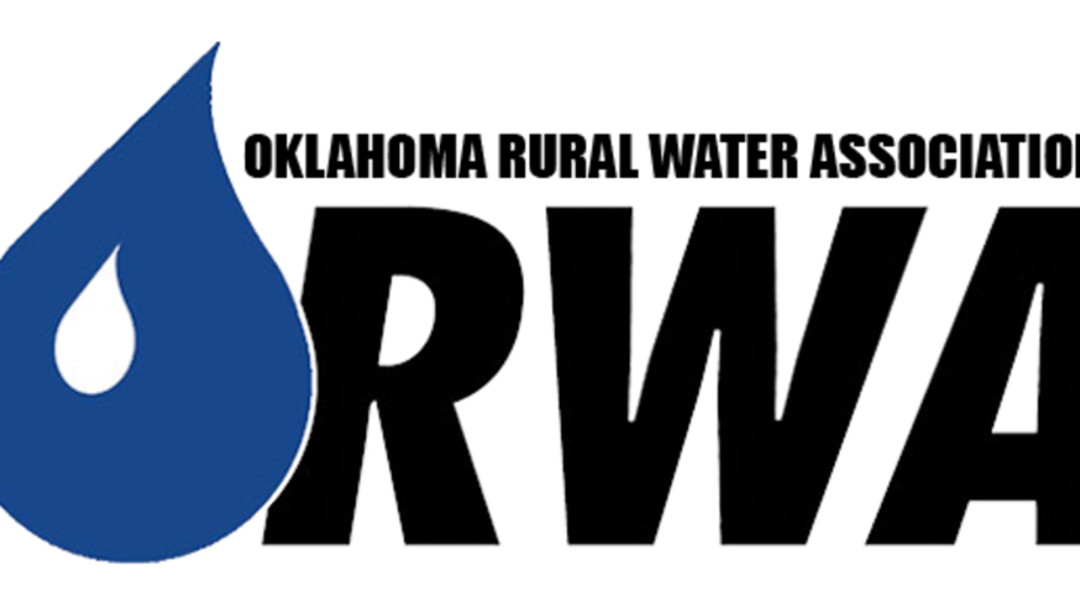 OK Rural Water Association logo. "Oklahoma Rural Water Association" is in small black letters above a giant "RWA" with a large raindrop partially on top of the "R."