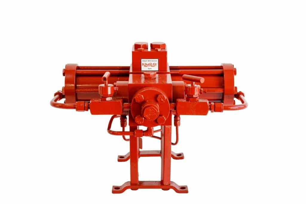 A fire engine-red KIMRAY Glycol Energy Exchange Pump. The pump is a short tube on two legs with a square head on the front.