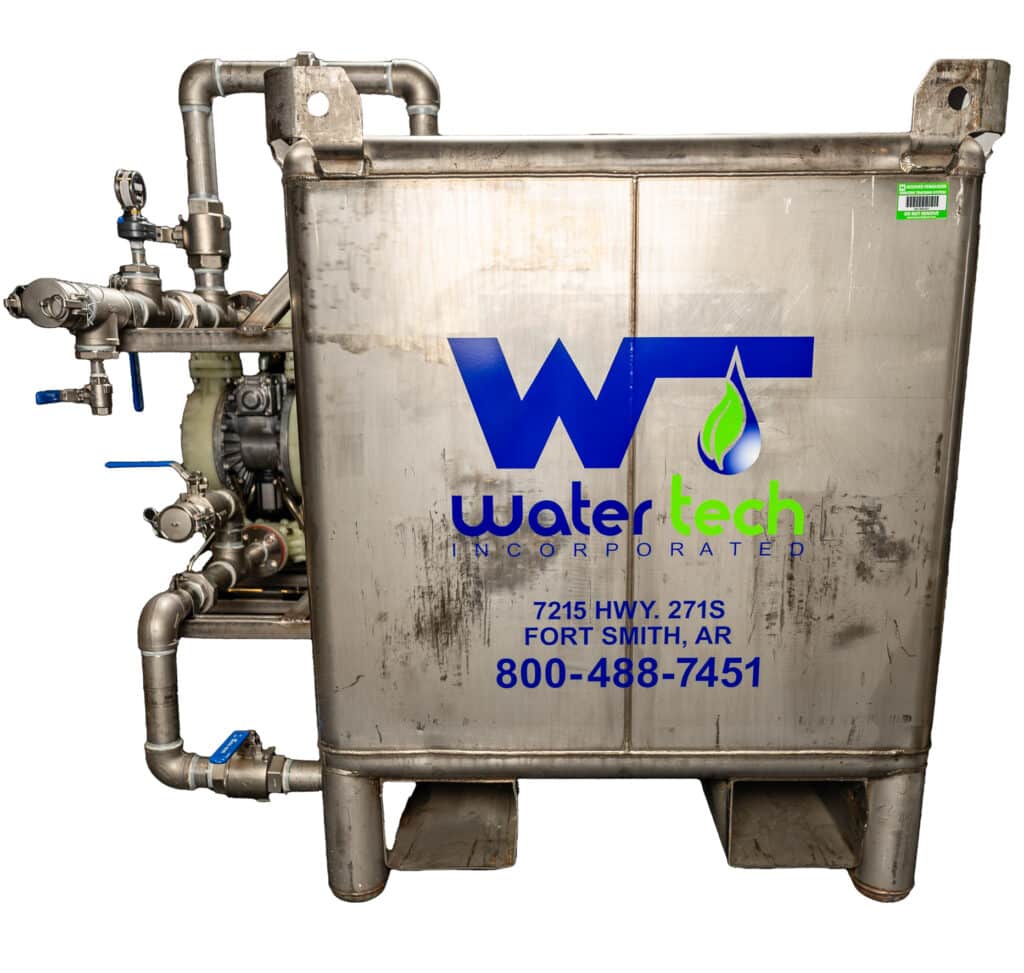 A dirty metal ethanol tank with the Water Tech Incorporated logo on the front in blue and green letters. The address of the company is in blue underneath it.